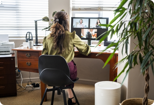 Person attending a remote meeting from a desk